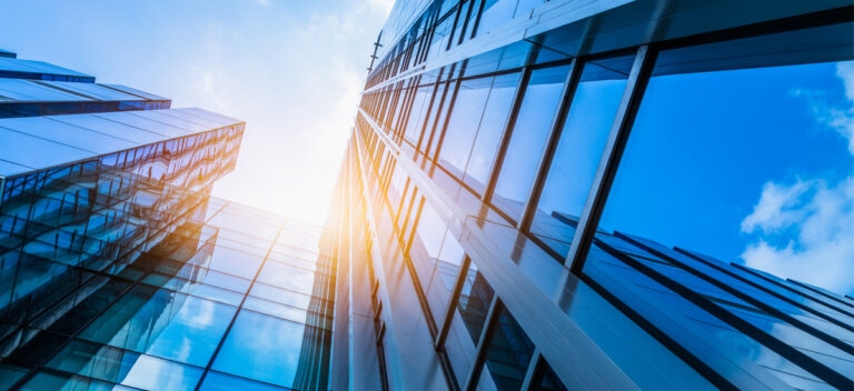 sunshing on glass building, ground up perspective